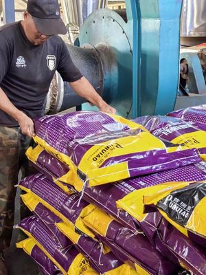 Spray-dried, high protein, low ash, low moisture fish feed additive